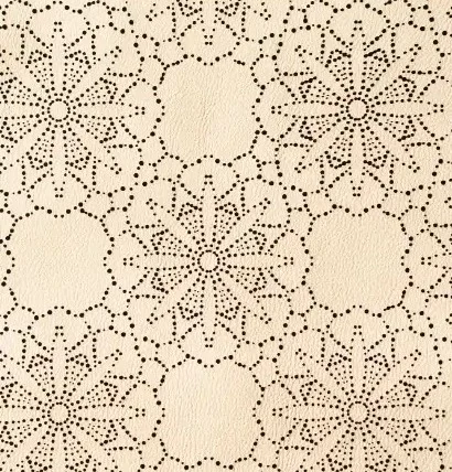 Cuir crème perforé de rosaces pointillistes